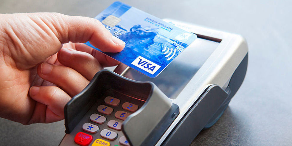 card-tapping-on-a-pos-terminal-contactless-payment